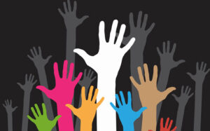 Hands raised in the air to represent volunteering