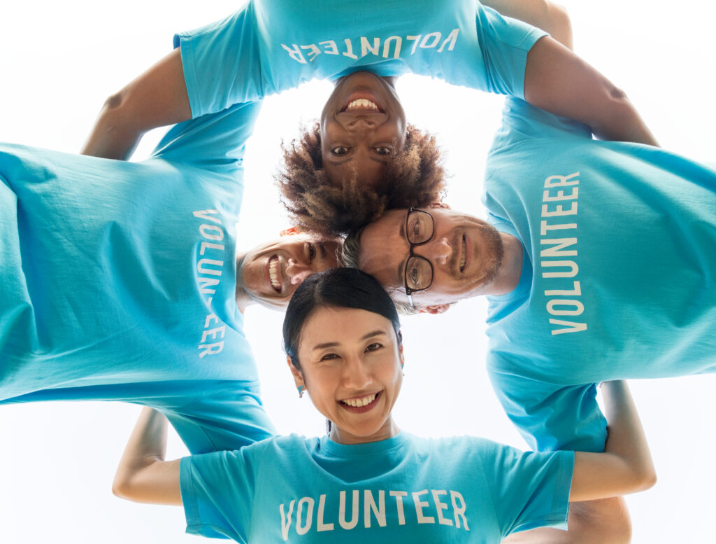 Group of volunteers in blue t-shirts